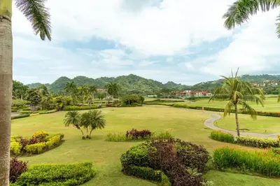 a view of the gardens at the resort at CR Luxury Del Mar 5H 2 Bdrm in La Mona