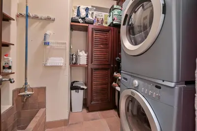 a washer and dryer in a small bathroom at CR Luxury Montebello 3F 3 Bdrm in Jacó