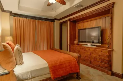 a bedroom with a bed and a flat screen tv at CR Luxury Terrazas De Marbella 3A 3 Bdrm in La Mona
