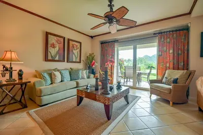 a living room with a couch and a ceiling fan at CR Luxury Del Mar 4Q 2 Bdrm in La Mona