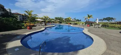 a large blue swimming pool in a resort at CR Luxury Del Mar 4Q 2 Bdrm in La Mona