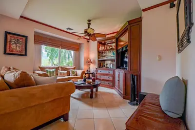a living room with a couch and a tv at CR Luxury Del Mar 4Q 2 Bdrm in La Mona