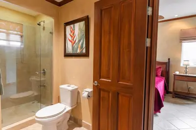 a bathroom with a toilet and a shower at CR Luxury Veranda 7B 2 Bdrm in La Mona