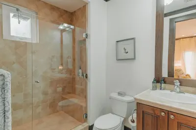 a bathroom with a shower and a toilet and a sink at CR Luxury Altavista 2A 3 Bdrm in La Mona