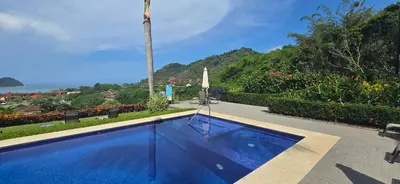 a swimming pool with a view of the ocean at CR Luxury Altavista 2A 3 Bdrm in La Mona