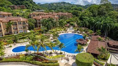 an aerial view of a resort with a pool and palm trees at CR Luxury Altavista 2B 3 Bdrm in La Mona