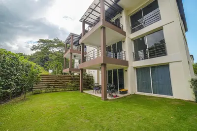 a large house with a lawn in front of it at CR Luxury La Estancia Floresta #05 3 Bdrm in La Mona