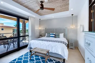 a bedroom with a bed and a balcony at JACO HEAVEN Beachfront Penthouse in Jacó