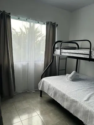 a bedroom with two bunk beds and a window at Berakah Apartment in Fortuna