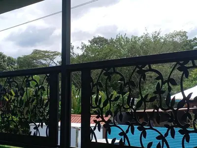 a window with a view of a swimming pool at Berakah Apartment in Fortuna