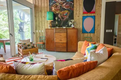 a living room with a couch and a table at Casa AguasPoolYoga deckwalk to Surf Point in Santa Teresa Beach