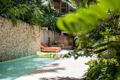 a swimming pool in a backyard with a couch at MAR A MAR Nest Bungalow - Pool WalkTo Beach in Santa Teresa Beach