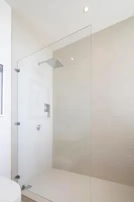 a glass shower in a bathroom with a toilet at Casa AtrapasueñosEpic View Surfer's Paradise in Santa Teresa Beach
