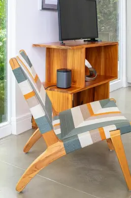 a wooden chair sitting in front of a tv at Casa AtrapasueñosEpic View Surfer's Paradise in Santa Teresa Beach