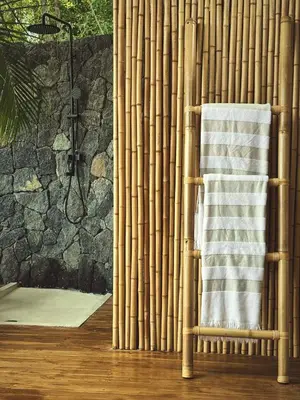 a bamboo towel rack in a bathroom with a shower at Casa RicaSunset ocean view pool fiber optic in Cóbano