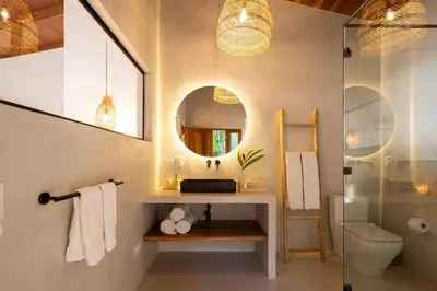 a bathroom with a sink and a mirror at Casa RicaSunset ocean view pool fiber optic in Cóbano