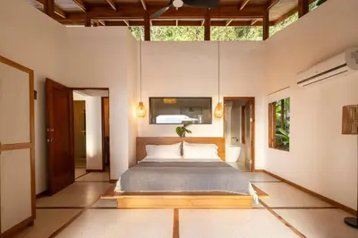 a bedroom with a bed in a room at Casa RicaSunset ocean view pool fiber optic in Cóbano