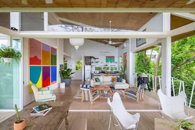 a living room with a table and chairs at Casazul - Tropical escape ocean views in Santa Teresa Beach
