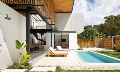 a pool in the backyard of a house at Naia Surf VillasWalk to Beach 2 Private Pools in Santa Teresa Beach