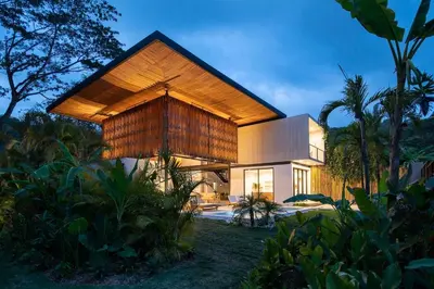 a modern house with a large wooden roof at Naia Surf VillasWalk to Beach 2 Private Pools in Santa Teresa Beach