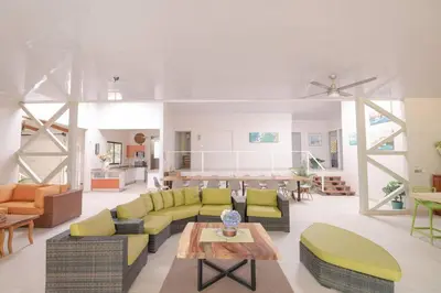 a large living room with couches and a table at Luxury Beachfront VillaBest Surf Spot in Santa Teresa Beach