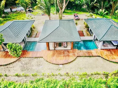 an aerial view of a house with a swimming pool at Villa Ayla - Santa Teresa Minutes from the beach in Carmen