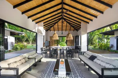 an open living room with couches and a table at Villa Ayla - Santa Teresa Minutes from the beach in Carmen