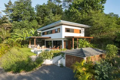 an aerial view of a house with trees at Casa Colibri - Stunning ocean view in Santa Teresa Beach