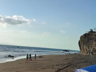 a group of people standing on a beach at SJO airport eco-Escape, Villa jr 2 & Pool in Tivives