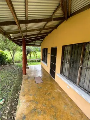 an outside view of a building with awning and a porch at Costa Rica Getaway in Jacó