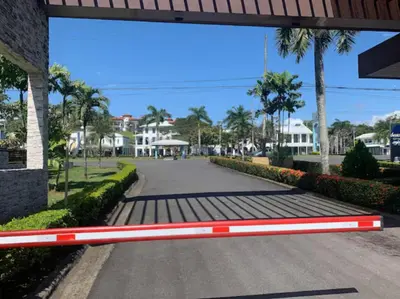 a street with a red and white bench on a road at 2 Bedroom Oceanfront Condo with Wi-Fi, AC and Pool in Bejuco