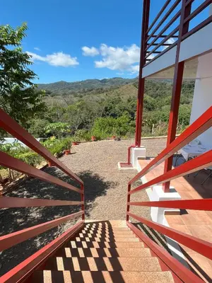 a view from the stairs of a house at Apartamentos Aquí Me Quedo in Nandayure