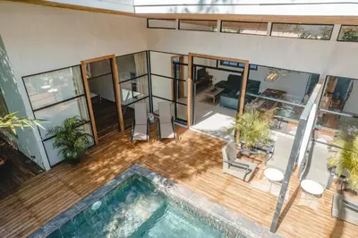 an aerial view of a house with a swimming pool at Villa Primavera Santa Teresa Center- walking distance to the beach in Santa Teresa Beach