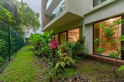 a house with plants in front of it at Pura Vida Peaceful Condo At Become Nosara in Nicoya