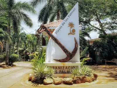a sign in front of a resort with a snake at Pineapple Condo at Villa Riviera in Coco