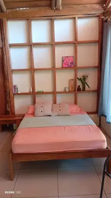 a bedroom with a bed in a room at Helenors estancia in Nicoya