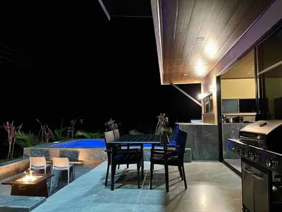 a kitchen and dining area with a table and chairs at Villa Macua Private Pool and Bird Watching in Fortuna