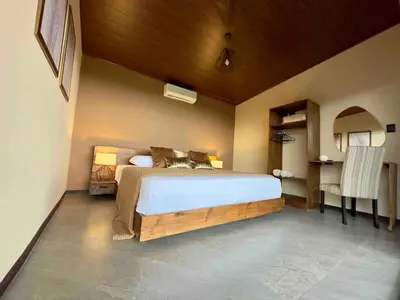 a bedroom with a large bed in a room at Villa Macua Private Pool and Bird Watching in Fortuna