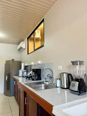 a kitchen with a sink and a counter top at Apartamento Bella Vista in Quepos