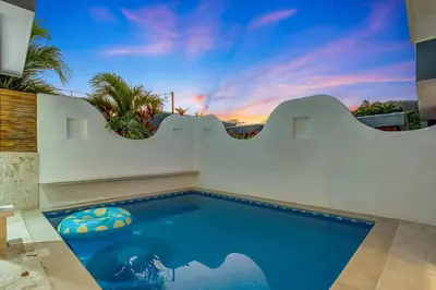 a swimming pool in a house with a sunset at Casa Anbara Private Pool in Pochote
