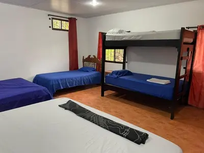 a room with two bunk beds and a bed at villa Alcaravan - 4 rooms home in Lagunillas