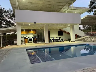 a house with a swimming pool in front of a house at villa Alcaravan - 4 rooms home in Lagunillas
