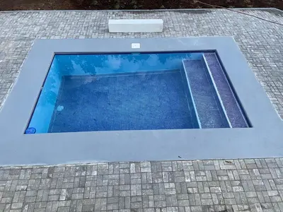 a pool of water on top of a brick sidewalk at villa Alcaravan - 4 rooms home in Lagunillas