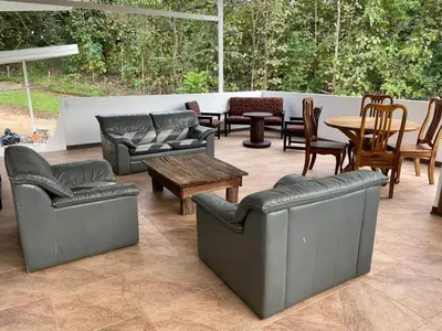 a patio with couches and tables and chairs at villa Alcaravan - 4 rooms home in Lagunillas