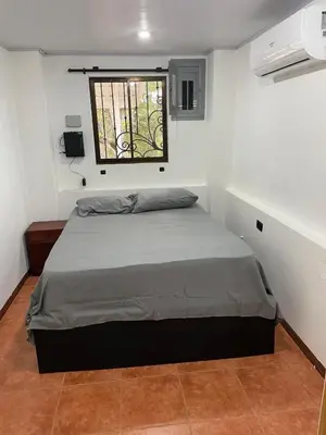 a bed in a room with a window at villa Alcaravan - 4 rooms home in Lagunillas
