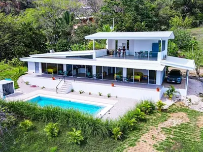 an aerial view of a house with a swimming pool at Casa Assaya in Nandayure