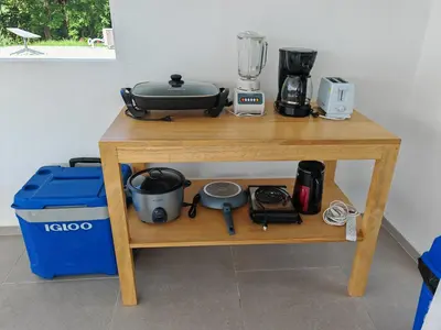 a wooden table with a blender on top of it at Casa Assaya in Nandayure