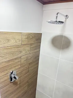 a bathroom with a shower and a sink at Bajamar, Puntarenas in Puntarenas