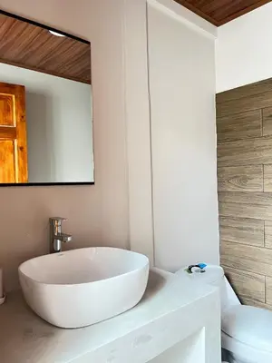 a bathroom with a large white tub and a toilet at Bajamar, Puntarenas in Puntarenas