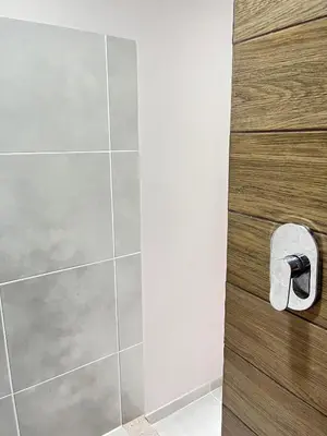 a shower stall with a roll of toilet paper at Bajamar, Puntarenas in Puntarenas